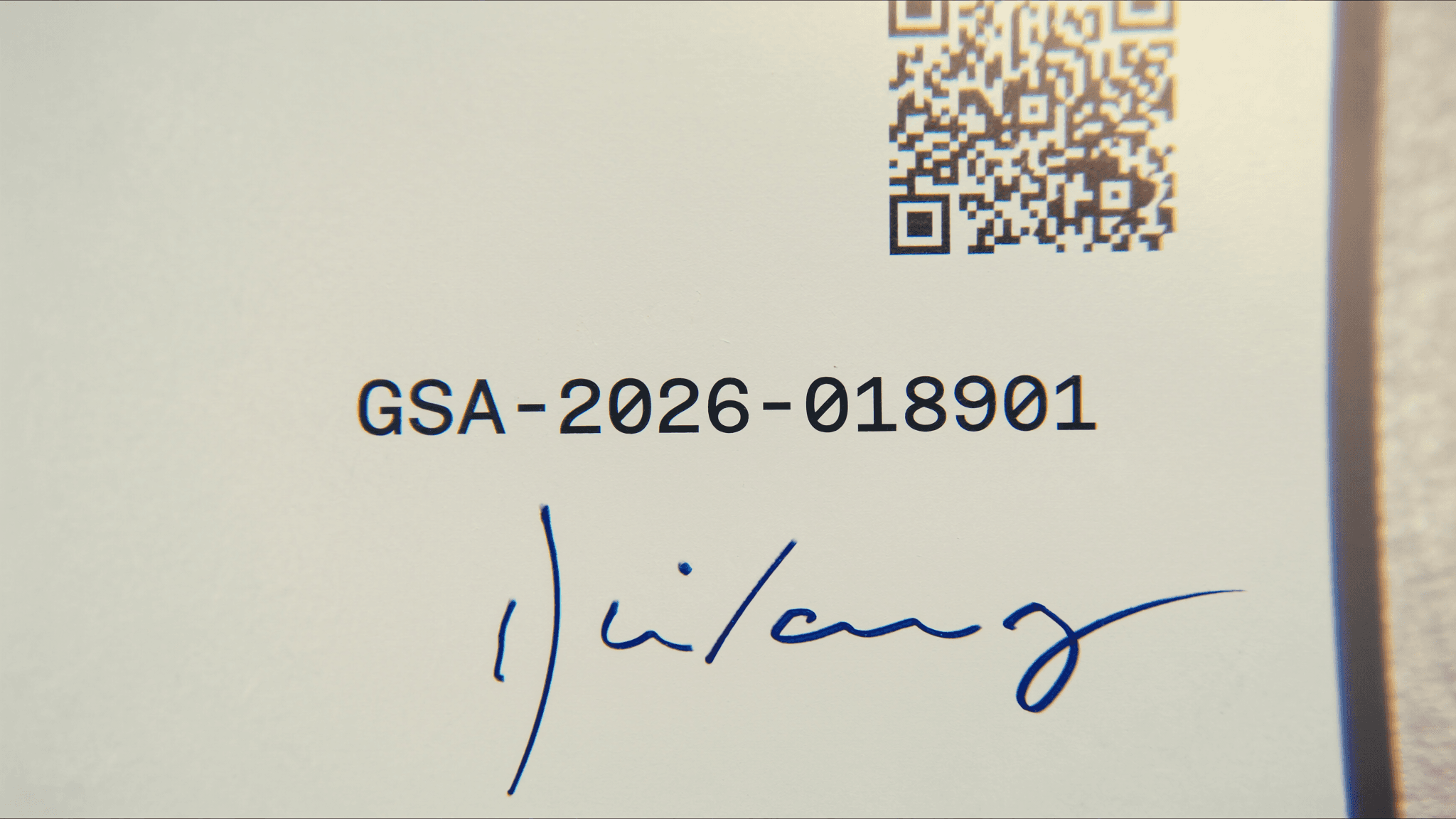 Macro view of a Certificate of Analysis showing accession number, QR code, and analyst signature